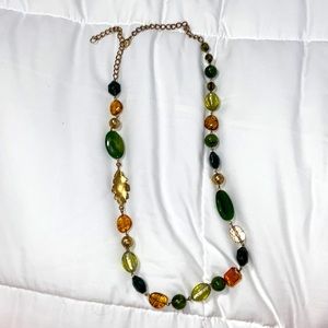 neckless, good with layering or by itself. pretty greens, orange, and browns